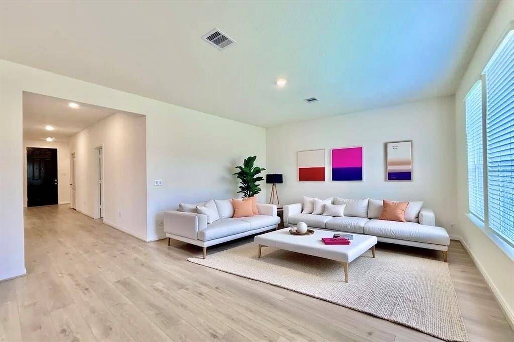 Spacious layout with a virtually staged family room.
