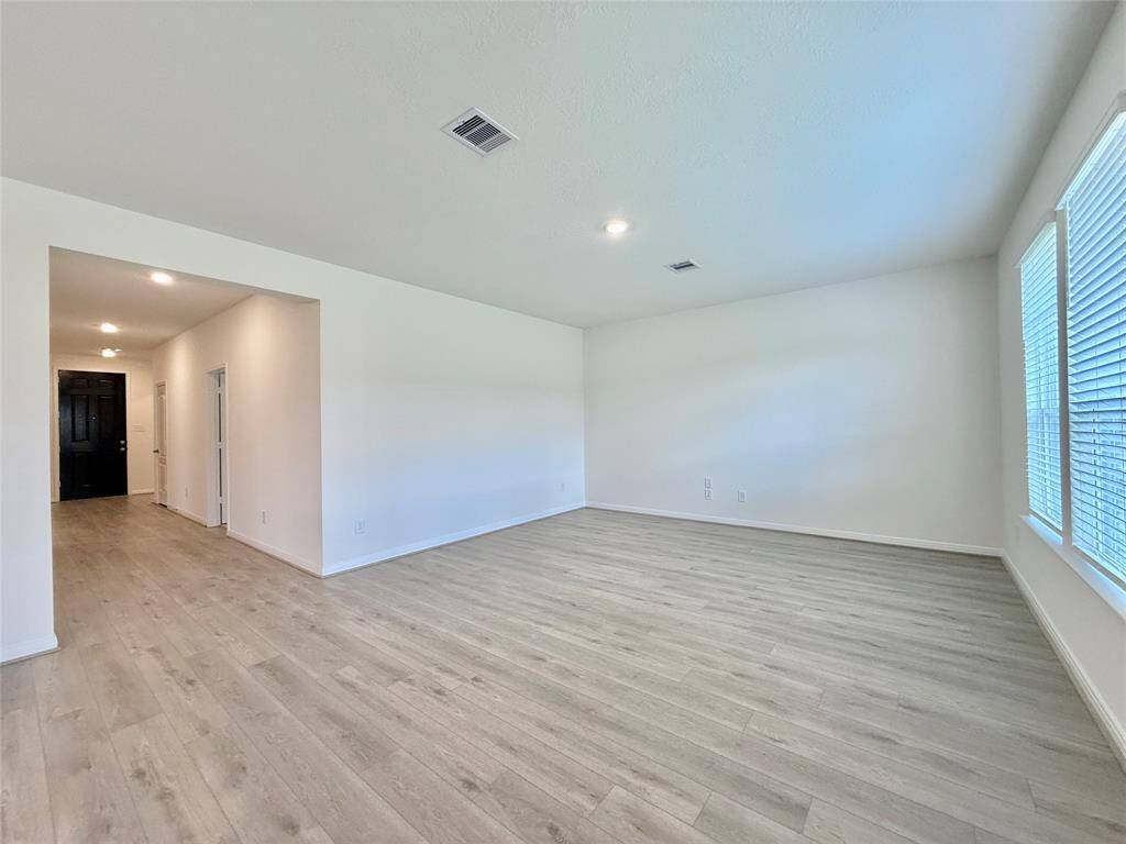 Family room boasts tons of natural light and a large window overlooking a private backyard with no back neighbors.