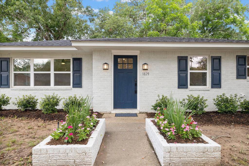 Recently painted, all brick home. Matching planter boxes add to the charming entrance. Recent front landscaping.