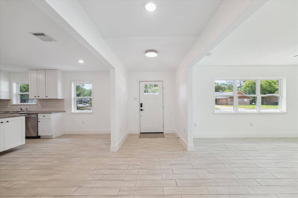 Very light and bright home with fresh paint and tile flooring throughout. Open concept living areas.
