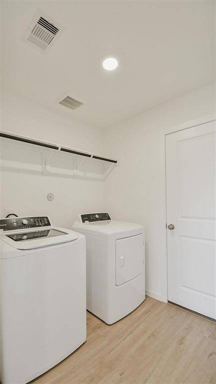 great size utility room including washer and dryer