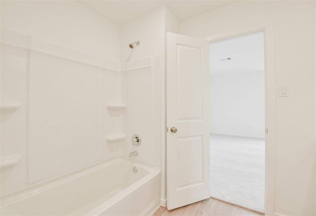 Primary bath upstairs with tub/shower combo