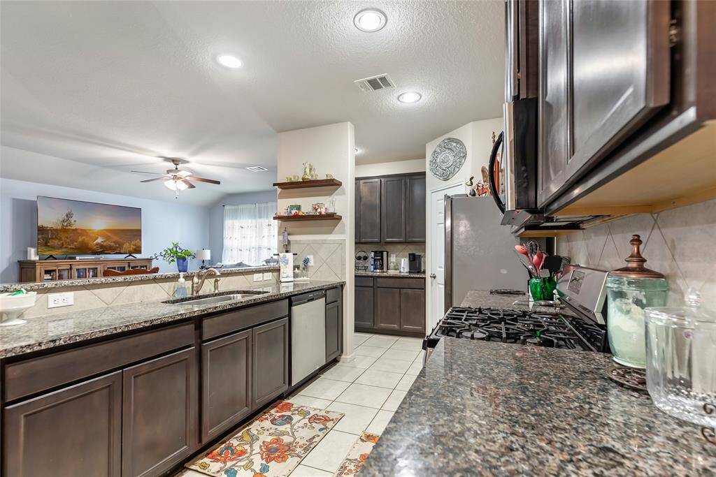 From Open Kitchen overlooking the Family Room with Butler's Pantry/Coffee Bar! Notice the Gas Range!