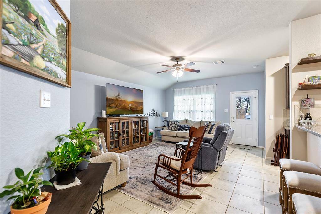 Spacious and Open Family Room. Notice the Breakfast Bar on the Right.