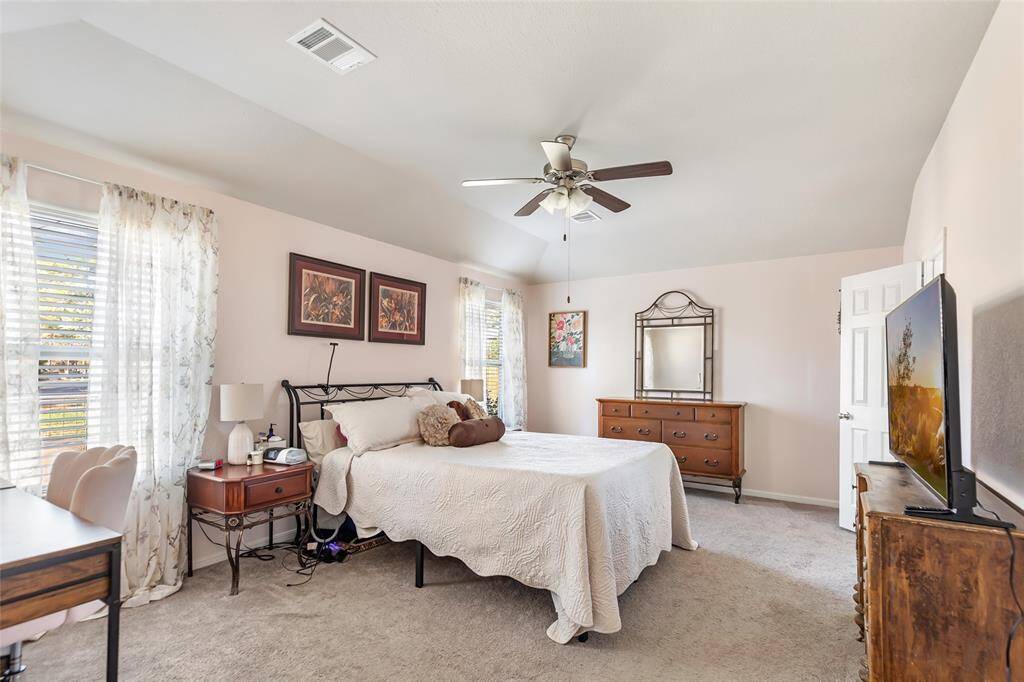 Spacious Primary Bedroom. Notice the windows providing natural lighting!