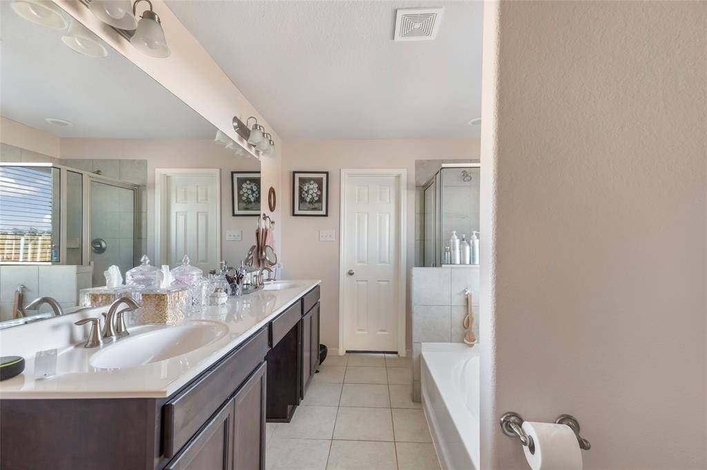 Another View of the En Suite Primary Bath with double sinks and separate shower and soaking tum