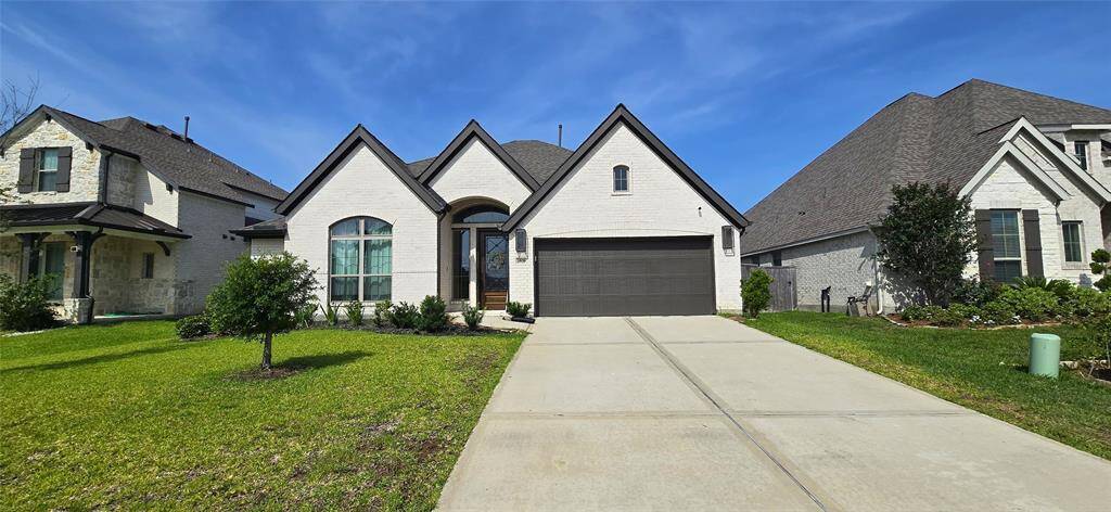 Home is set back from the street with its long driveway...
