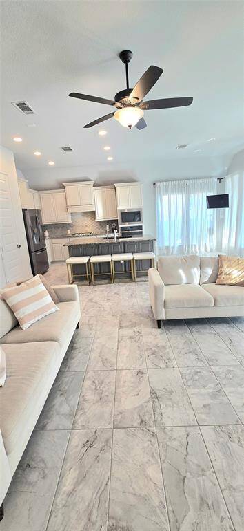 Spacious back porch, perfect for entertaining and grilling! (Representative picture)