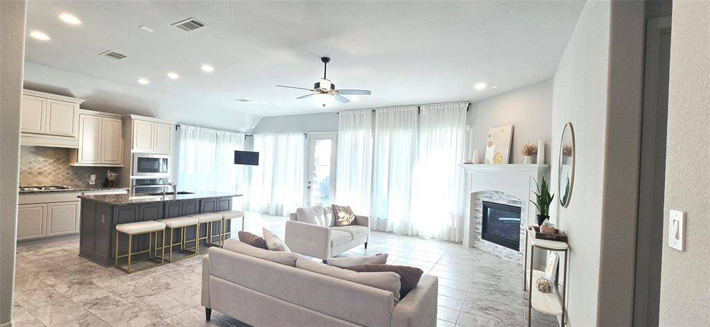 Generous living space; great kitchen with large island and bar area with stools, it has all necessary appliances!