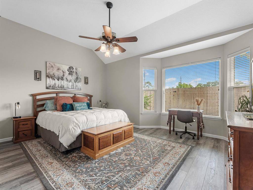 Primary bedroom is down and offers a sitting area next to the windows