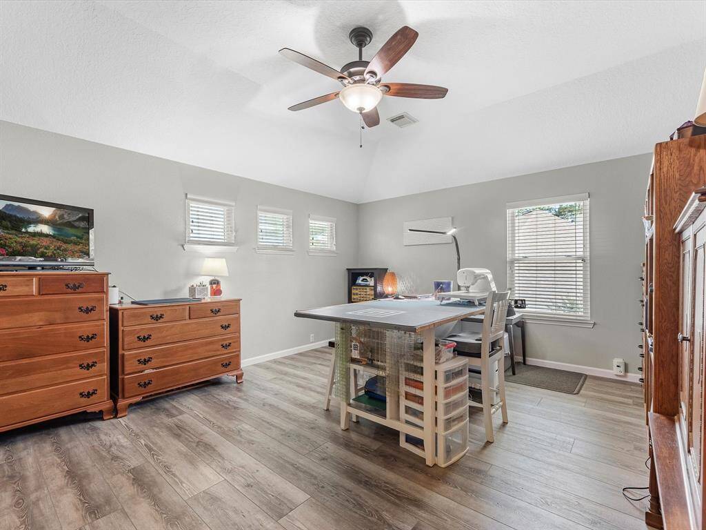 The owner is currently using this bedroom as a craft room. It's a spacious room!