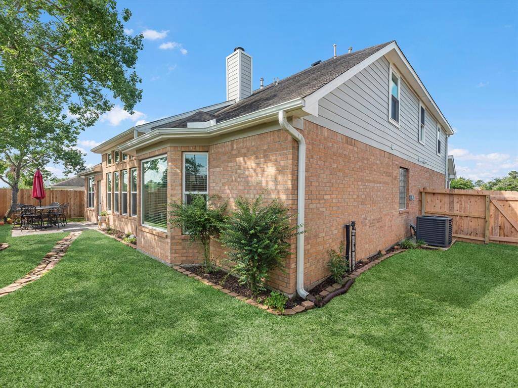 Nicely landscaped all around with a pretty yard