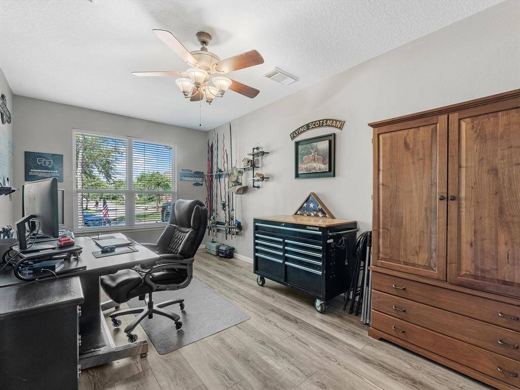 Directly to the left as you enter is the separate home office with French doors for privacy
