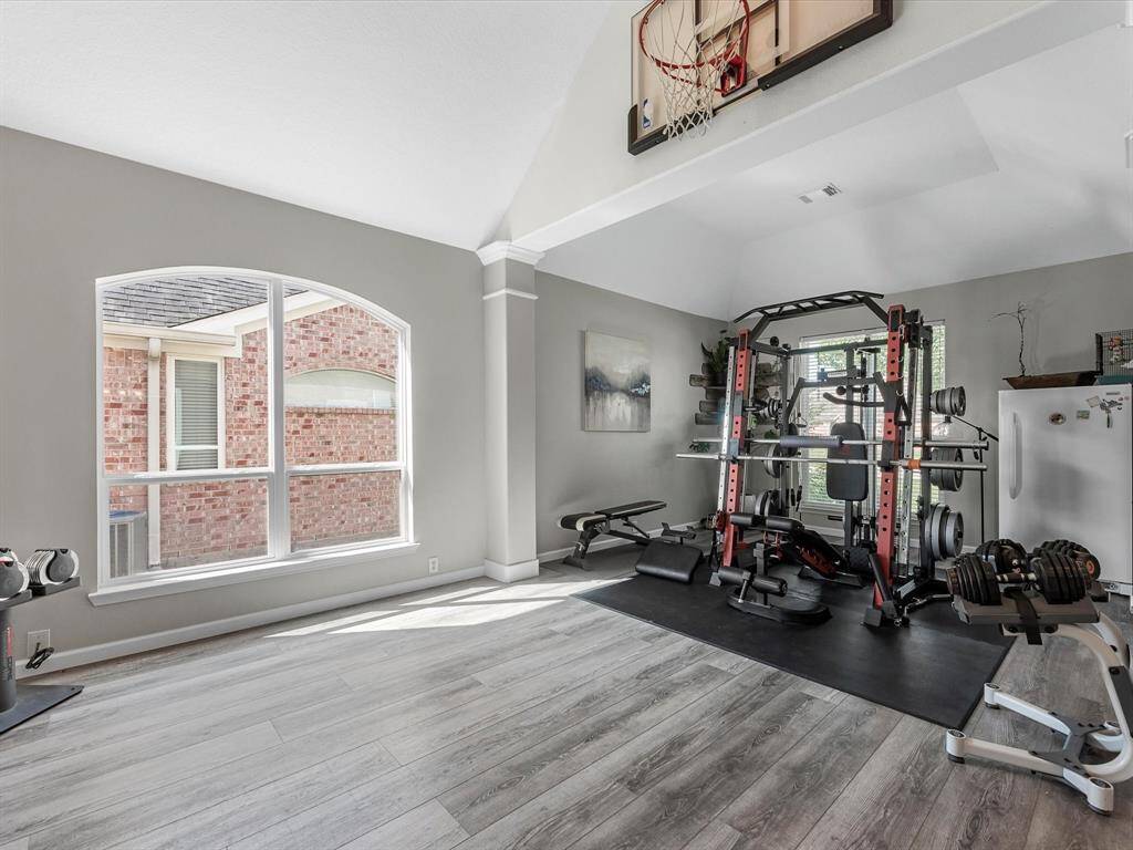 Opposite the office is the formal living/dining currently being used as a work out area