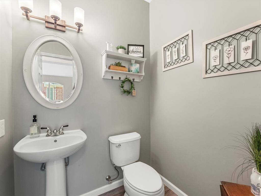 The powder room is tucked away and nicely updated
