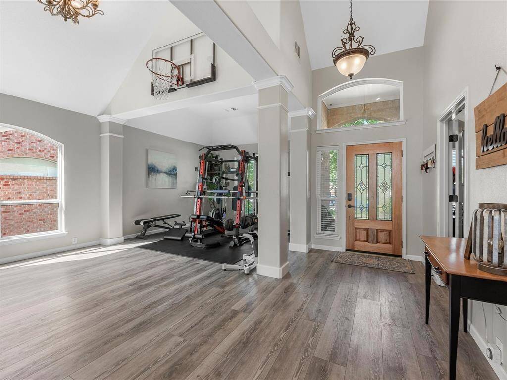 Looking back at the front door you can see the high ceilings and pretty solid surface floors