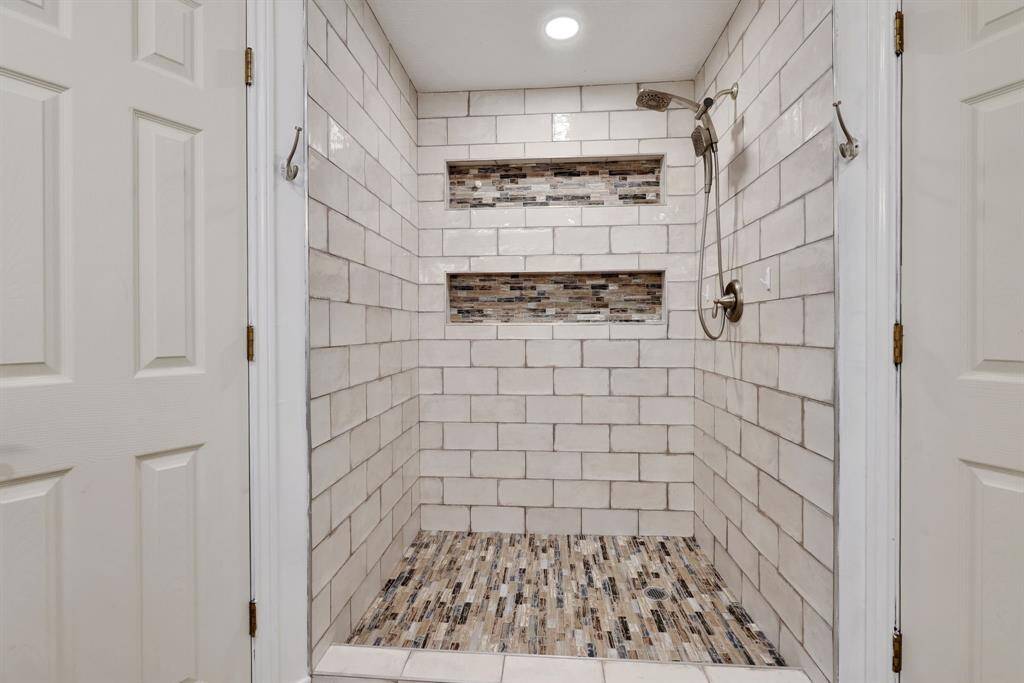 Oversized shower in primary with built-in storage