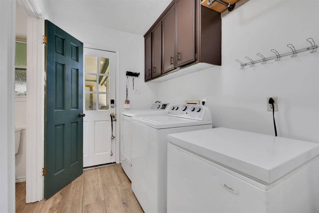 Large laundry room with 1/2 bath for guests