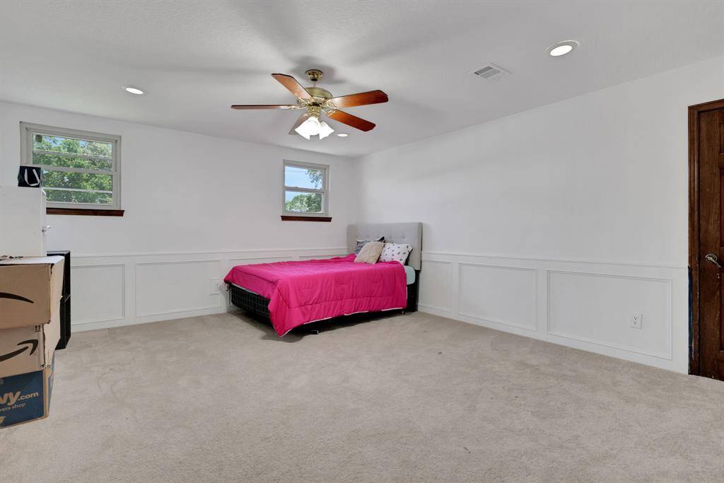 Secondary bedroom showcasing great natural light