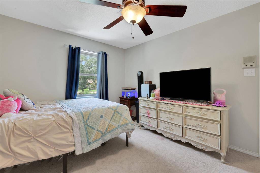 Another bedroom upstairs with beautiful natural light