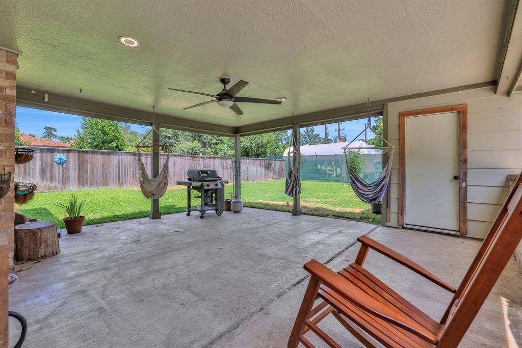 Covered back porch is great for entertaining