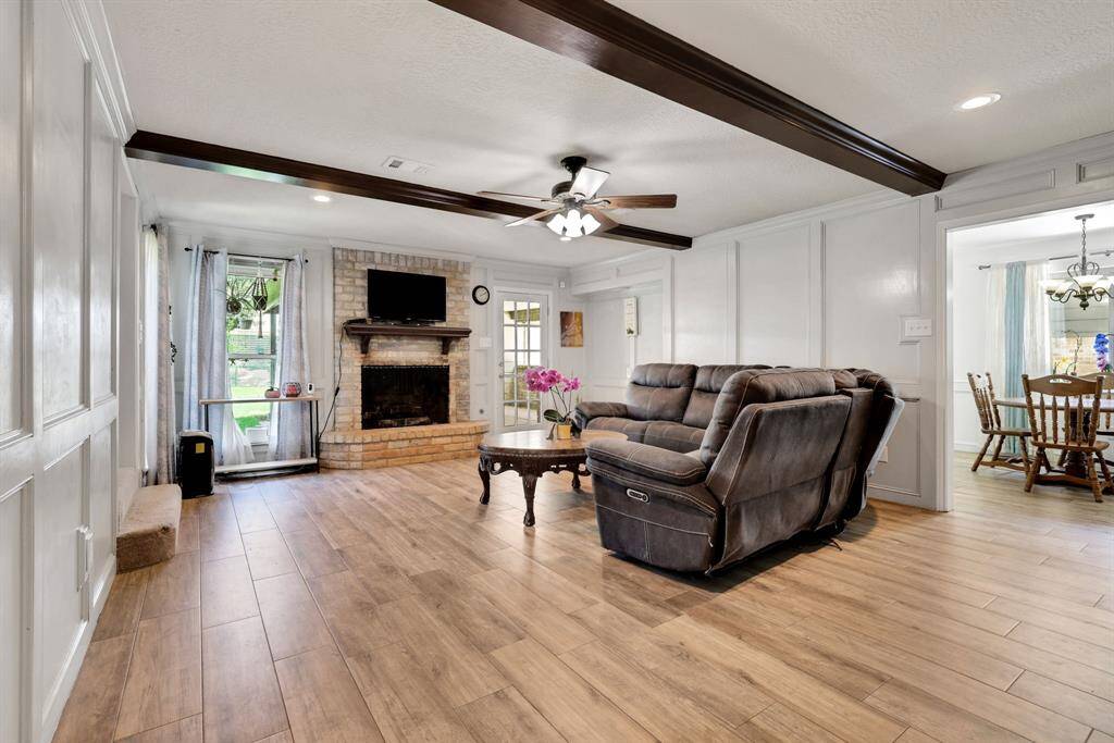 Living space showcasing the beautiful LVT flooring that flows throughout the downstairs