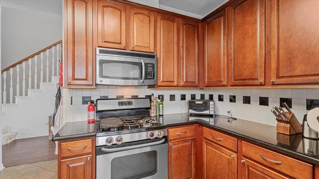 Kitchen includes gas cooktop for culinary enthusiasts