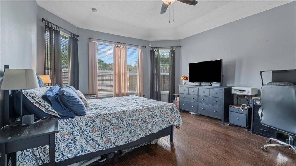 Secluded primary bedroom nestled at the back of the house, offering a peaceful retreat.