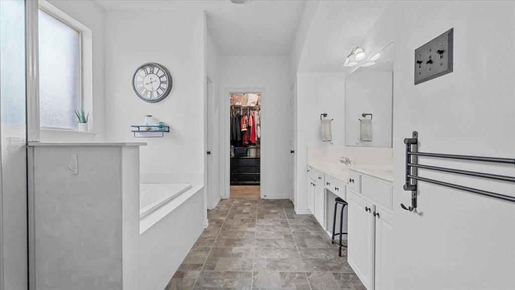 Features a soaking tub and separate shower for ultimate relaxation