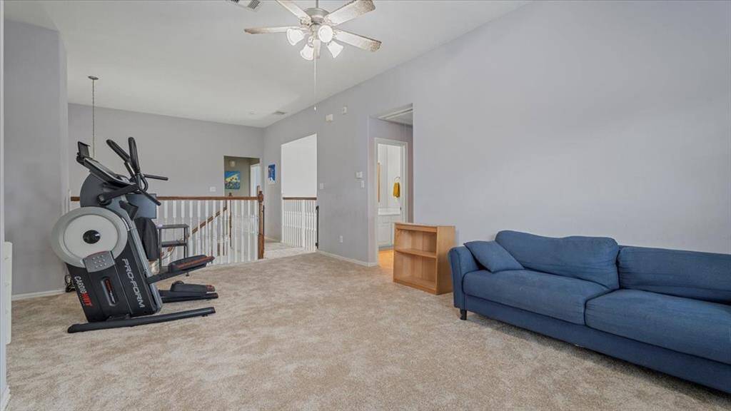 Spacious upstairs game room offers the perfect space for play or relaxation.