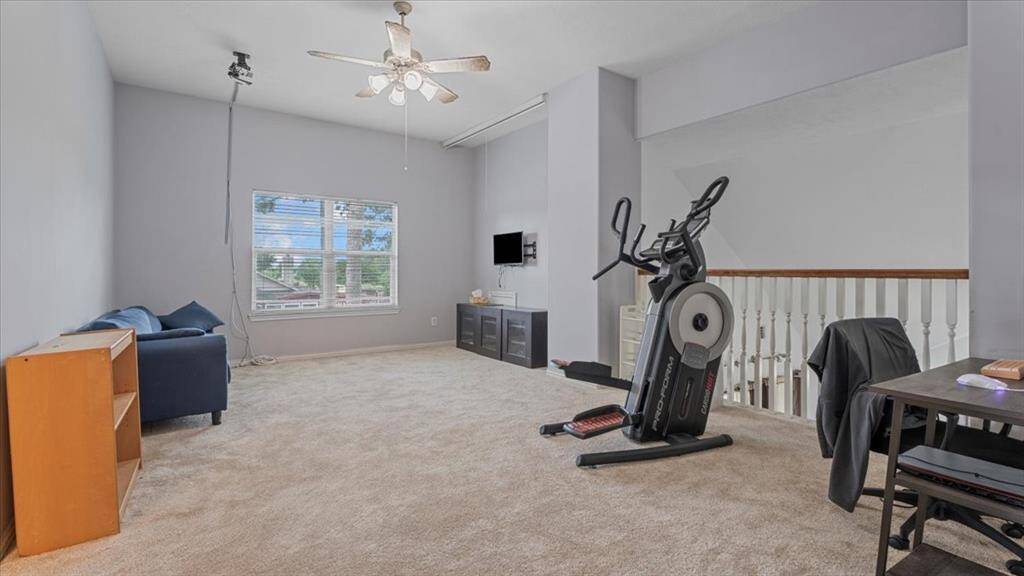 Highly versatile upstairs space, perfect for a game room, media room, home office, or gym.