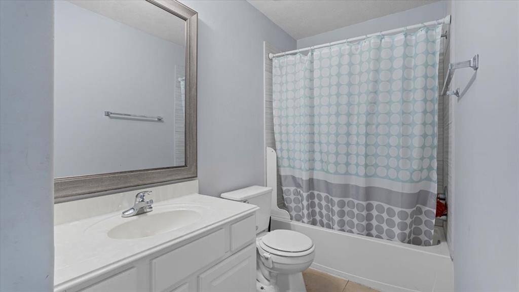 The secondary bath features a tub/shower combination—ideal for guests or family use.