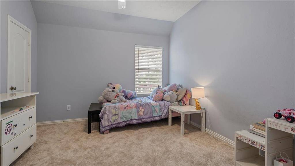 Spacious bedroom with ample room for furniture and relaxation.