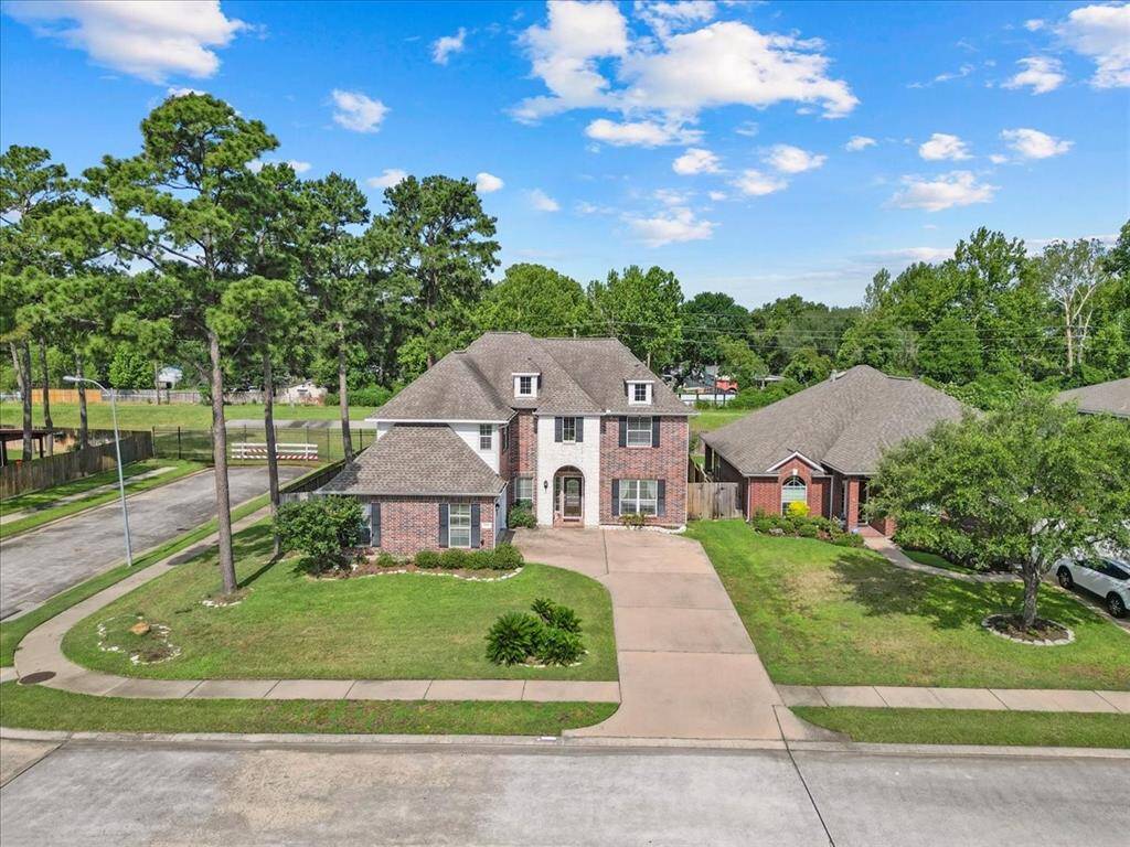 Extended driveway offers ample off-street parking for multiple vehicles