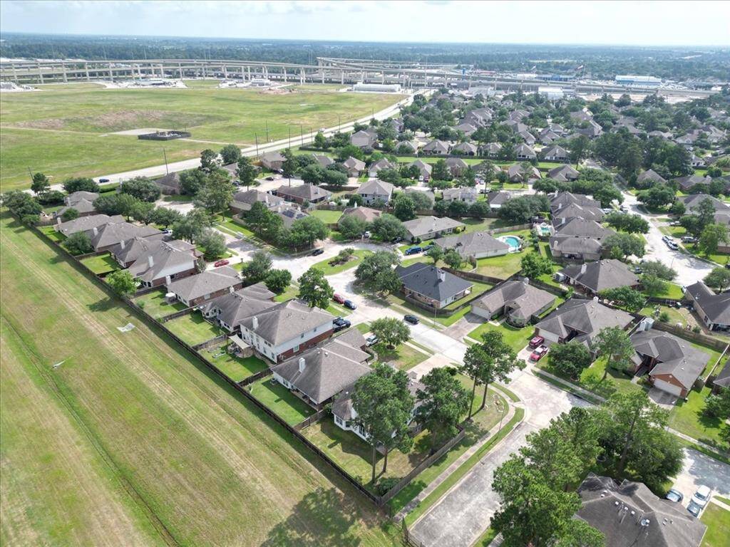 Take in the bird’s-eye view! This aerial shot highlights the home’s prime location and spacious lot within the neighborhood.