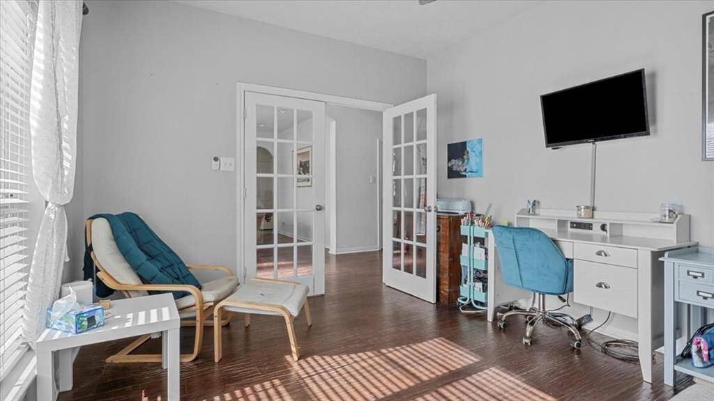 Bright home office with French doors and great natural light.