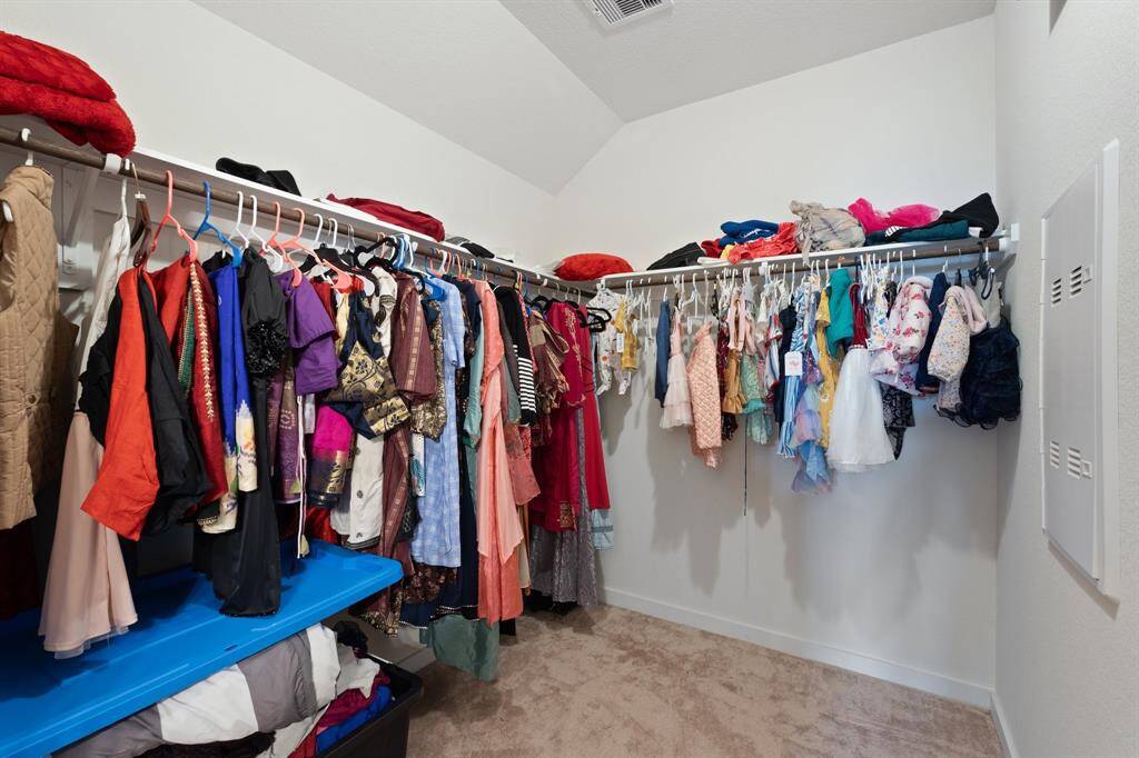 Impressive closet featuring built-in shelves, thoughtfully designed for both convenience and style, complementing the home’s luxury elements.