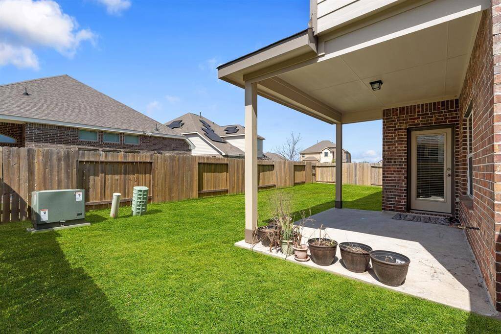 Beautiful outdoor living area designed for both relaxation and entertainment, featuring a covered patio perfect for unwinding.