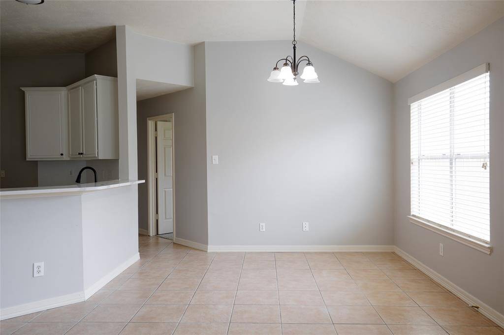 Kitchen opens to kitchen nook and livingroom