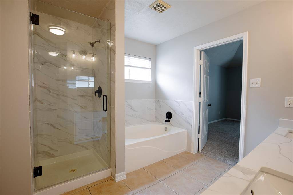 Primary bathroom with soaker tub and separate shower