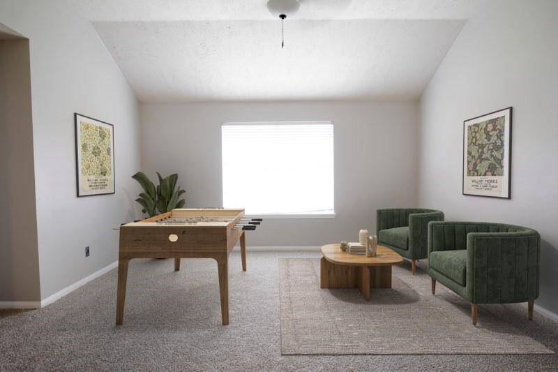 Virtually staged game room in the upstairs loft