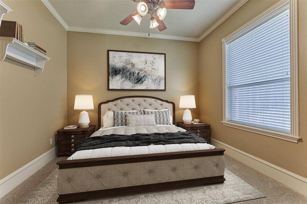 Spacious secondary bedroom down has fresh carpet with en-suite bathroom, conveniently offset from the main living area and primary suite for ultimate privacy. *This photo is virtually staged*