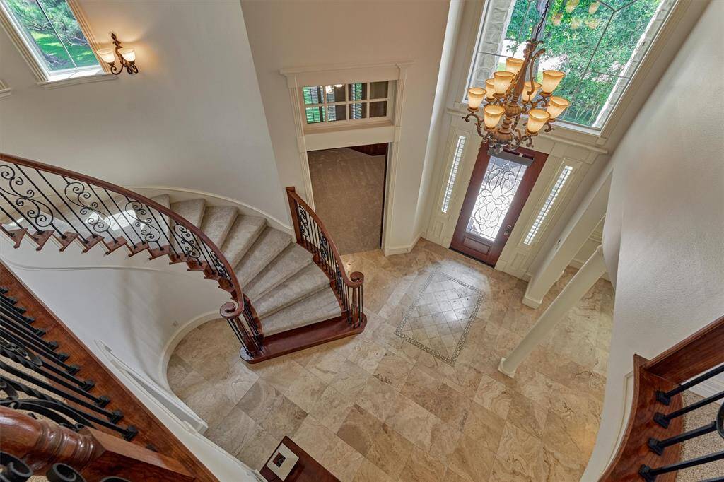 Incredible view of the grand 2-story foyer from the second floor landing.