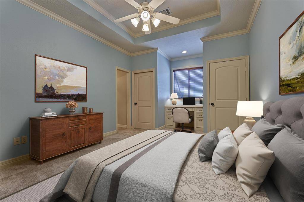 Secondary bedroom #3 is spacious with built-in desk, walk-in closet and trayed ceiling. *This photo is virtually staged*