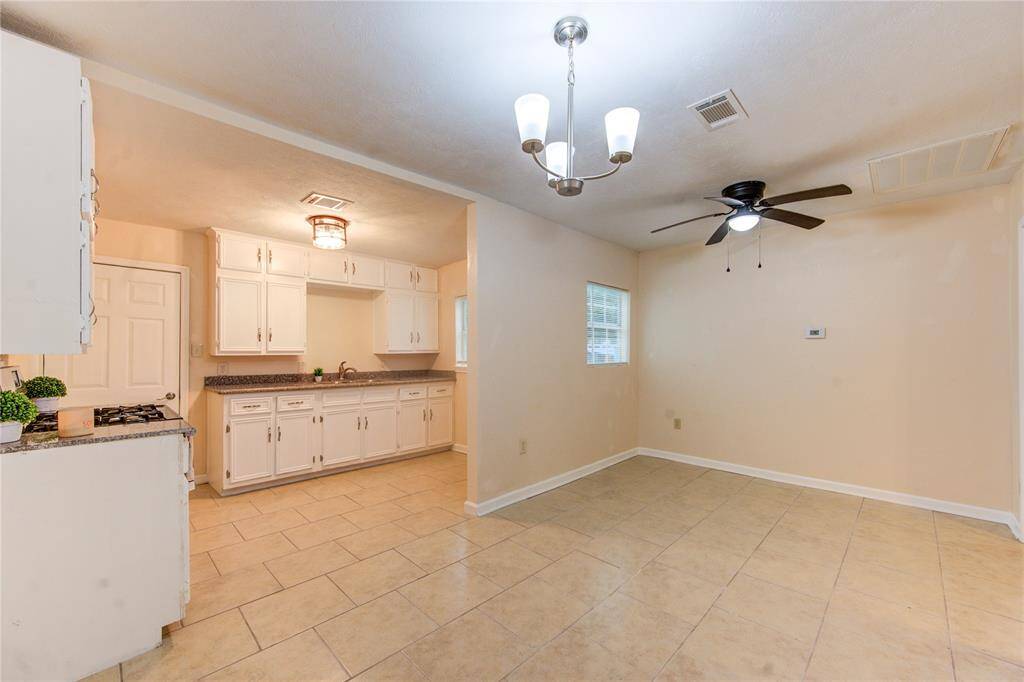 Dining area facing kitchen. Space for a full table!
