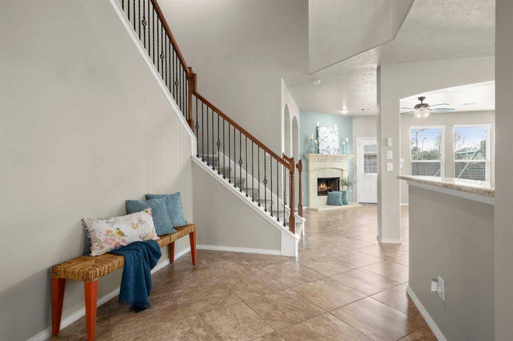 Foyer flows beautifully into the family room with a little nook to the left for a sitting area or tall Christmas tree.