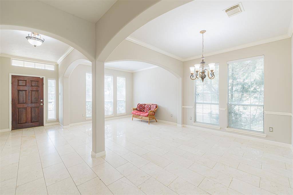 Another view of the entry, formal living and dining areas.