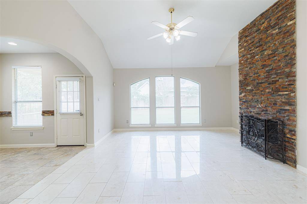 Another view of the family room showing the beautiful marble flooring.