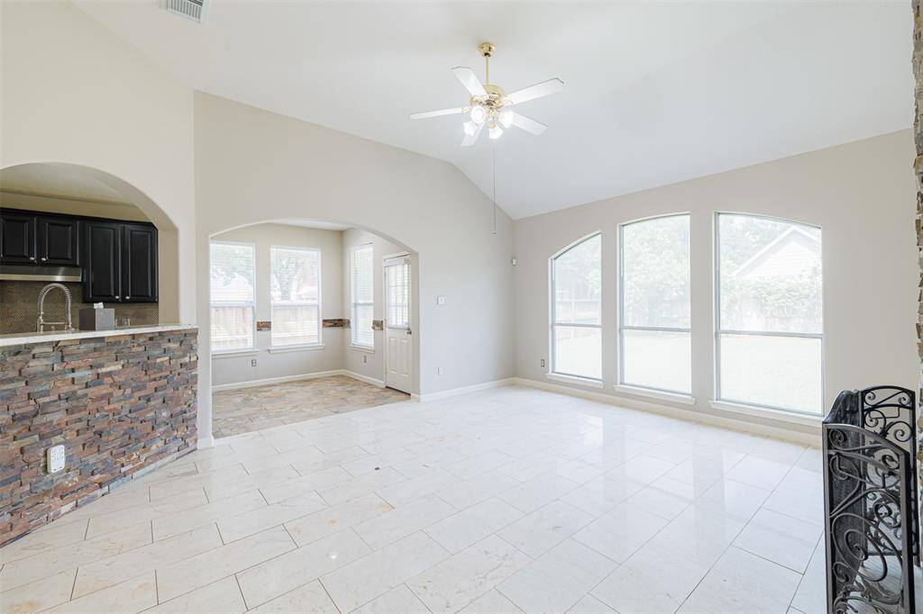 Family room, kitchen and breakfast areas are open and bright.
