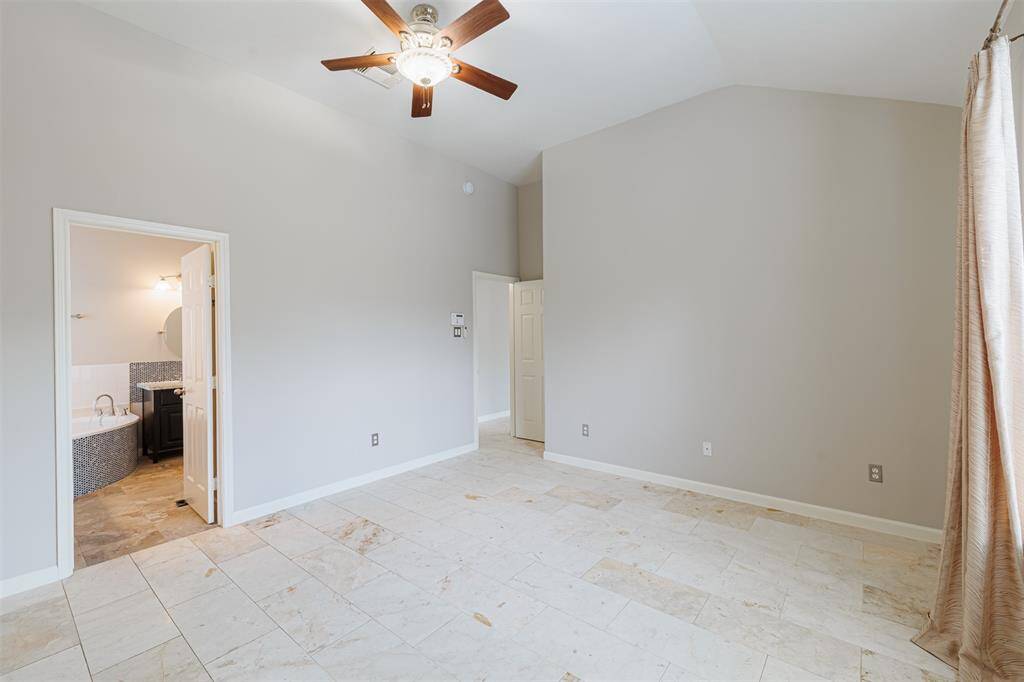 Another view of the primary suite looking towards the ensuite bath.